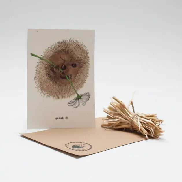 Postkarte mit bayrischem Gruß Grias di, Igel mit Blume - handgemalt auf Strohpapier